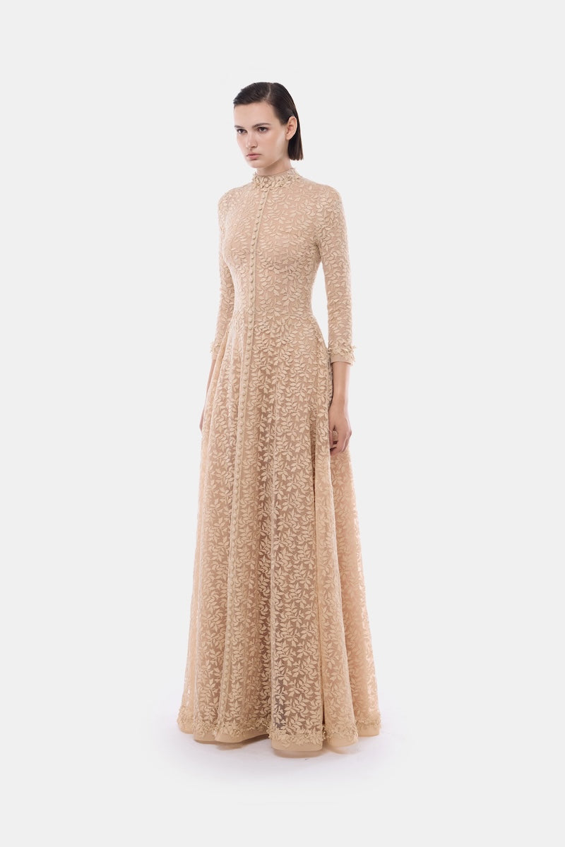 Elegant gold leaf button-front gown by Montsand, featuring a flowing design and intricate detailing perfect for formal occasions.