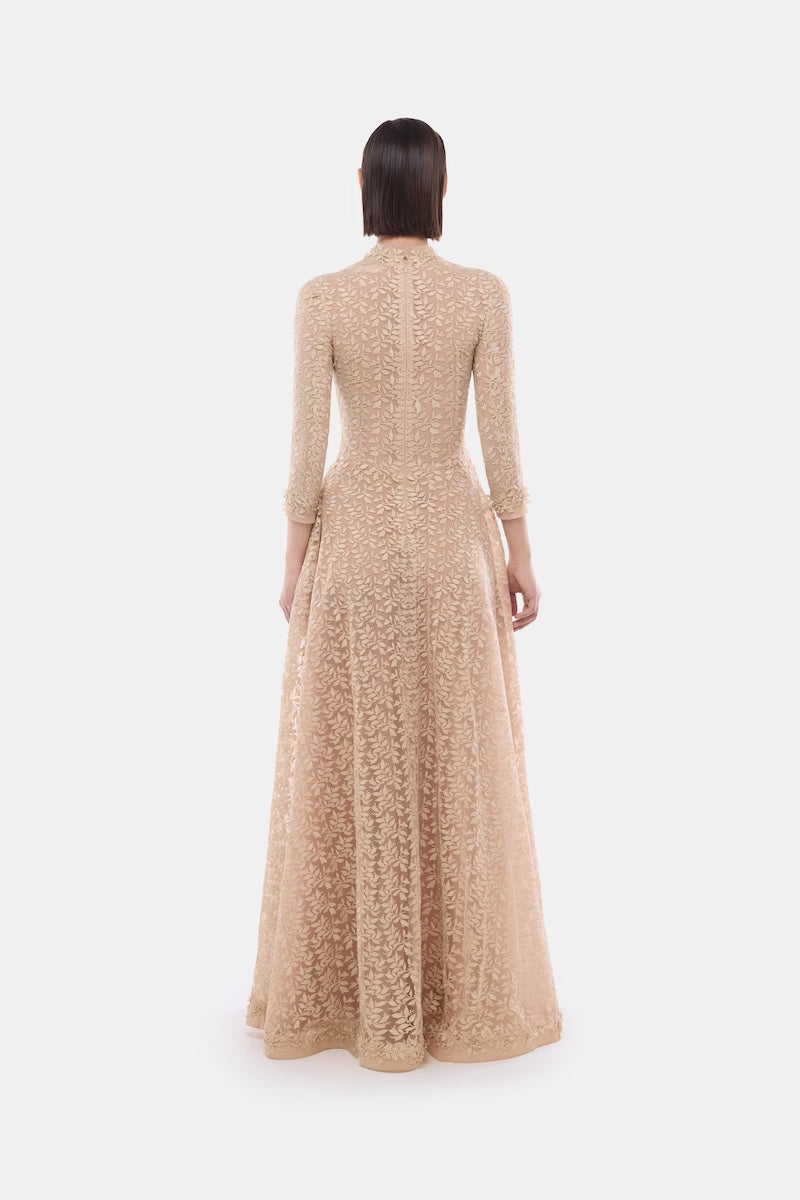 Elegant gold leaf button front gown by Montsand featuring a flowing silhouette and intricate detailing.