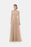 Elegant gold leaf button front gown by Montsand, featuring a sophisticated design with intricate detailing and a flowing silhouette.