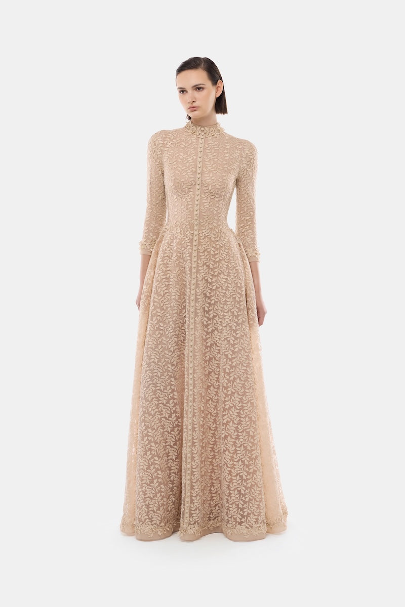 Elegant gold leaf button front gown by Montsand, featuring a sophisticated design with intricate detailing and a flowing silhouette.