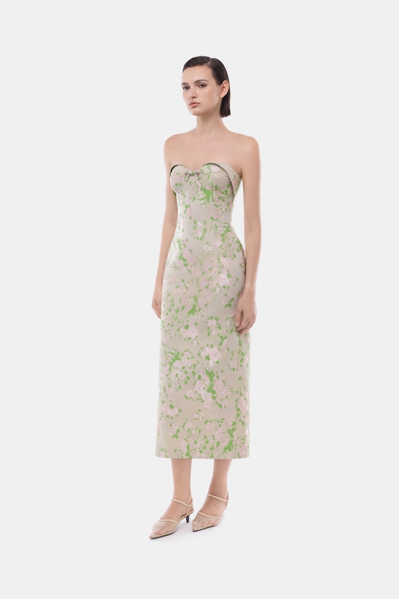 Pastel floral corsetry tube dress by Montsand featuring a fitted gown with floral patterns and a sleek, elegant silhouette.