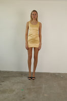 Yellow Daisy Dress mini by Junie featuring a flattering fit and floral pattern, front view showing sleeveless design.