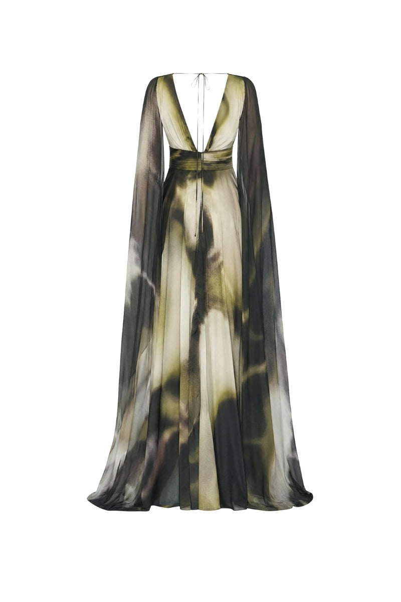 Green printed Dalia maxi dress by Tinta Latina featuring a flowy silhouette and vibrant floral pattern.