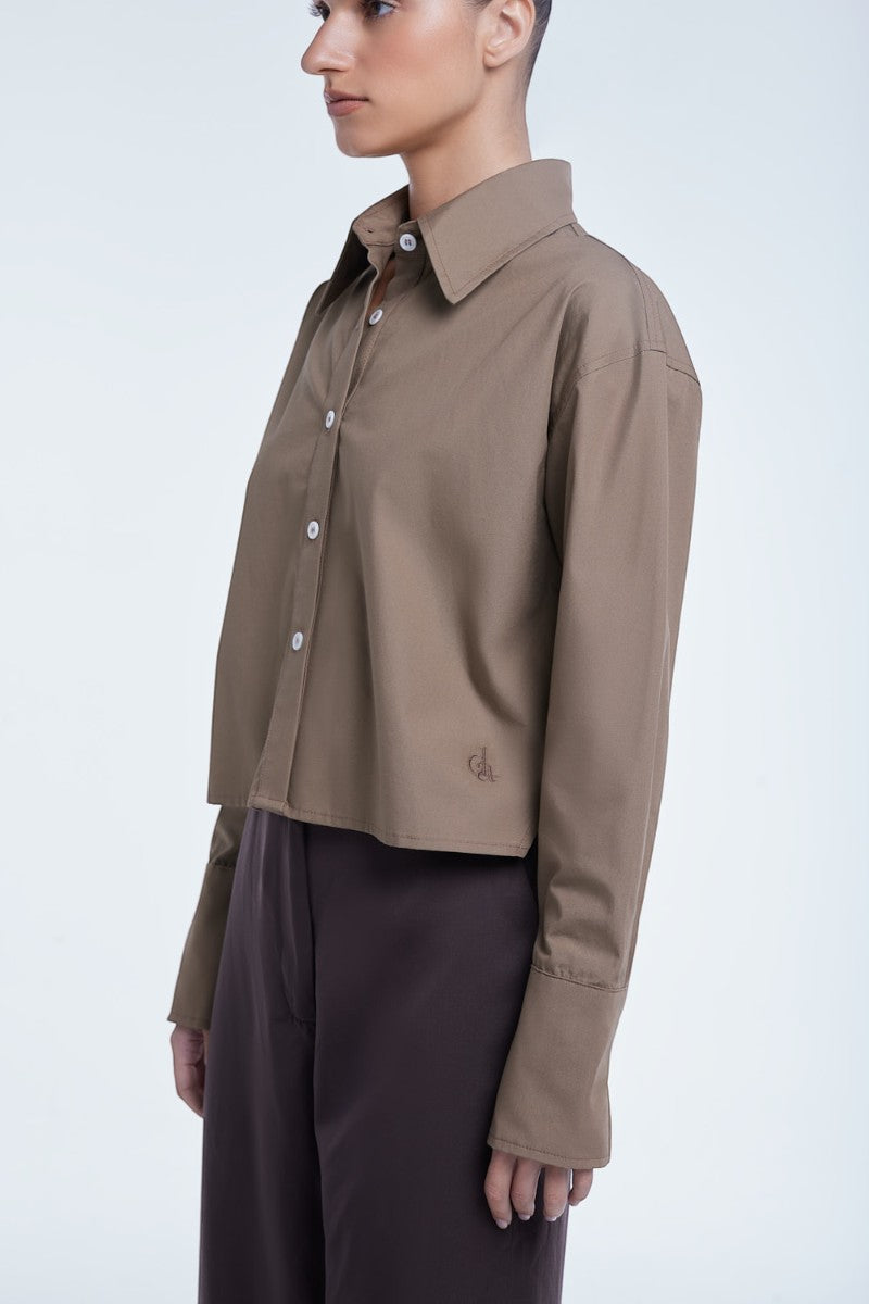 Cropped cotton button-down shirt from Dāl the Label, featuring a relaxed fit and classic collar, styled on a model.