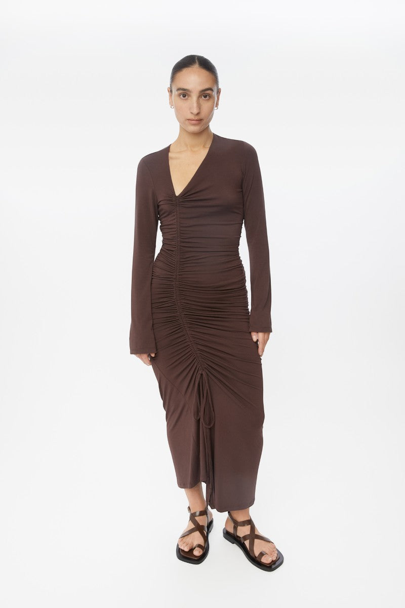 Dāl the Label modal ruched asymmetric midi dress displayed on a model, featuring a flowing silhouette and elegant design.