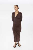 Dāl the Label modal ruched asymmetric midi dress in soft fabric with a draped, uneven hem, showcased on a model.