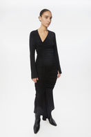 Dāl the Label modal ruched asymmetric midi dress in black, featuring gathered fabric and a stylish asymmetrical hem.