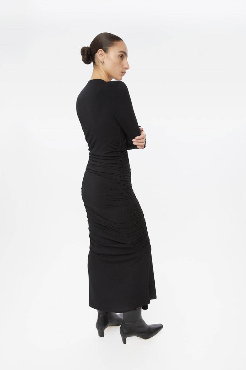 Dāl the Label modal ruched asymmetric midi dress with draped fabric and elegant design, showcased on a model in the lookbook image.