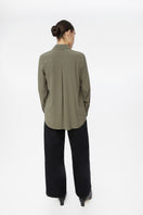 Relaxed long cuff top by Dāl the Label, featuring soft fabric and a casual fit, styled as a shirt in a fashion lookbook image.