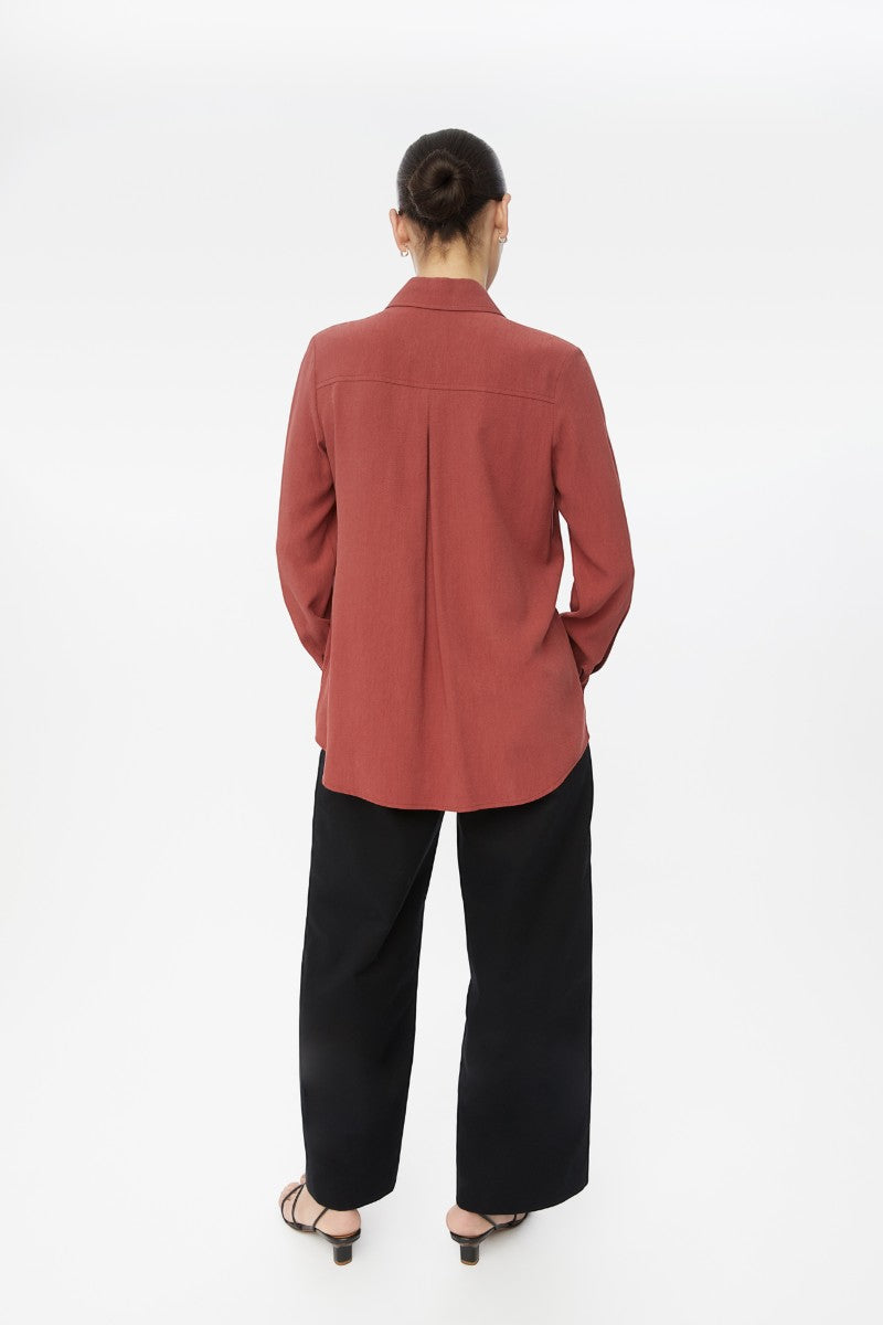 Relaxed long cuff top by Dāl the Label, shown in a casual shirt style with long sleeves and a comfortable fit.