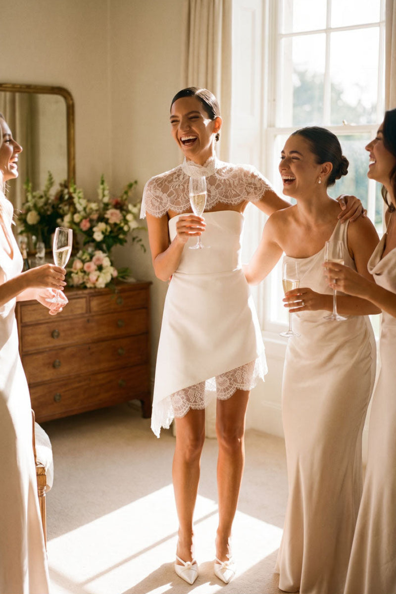 White KATEA mini dress by MATTERS, featuring a stylish and fitted design, shown on a model with a minimalist background.