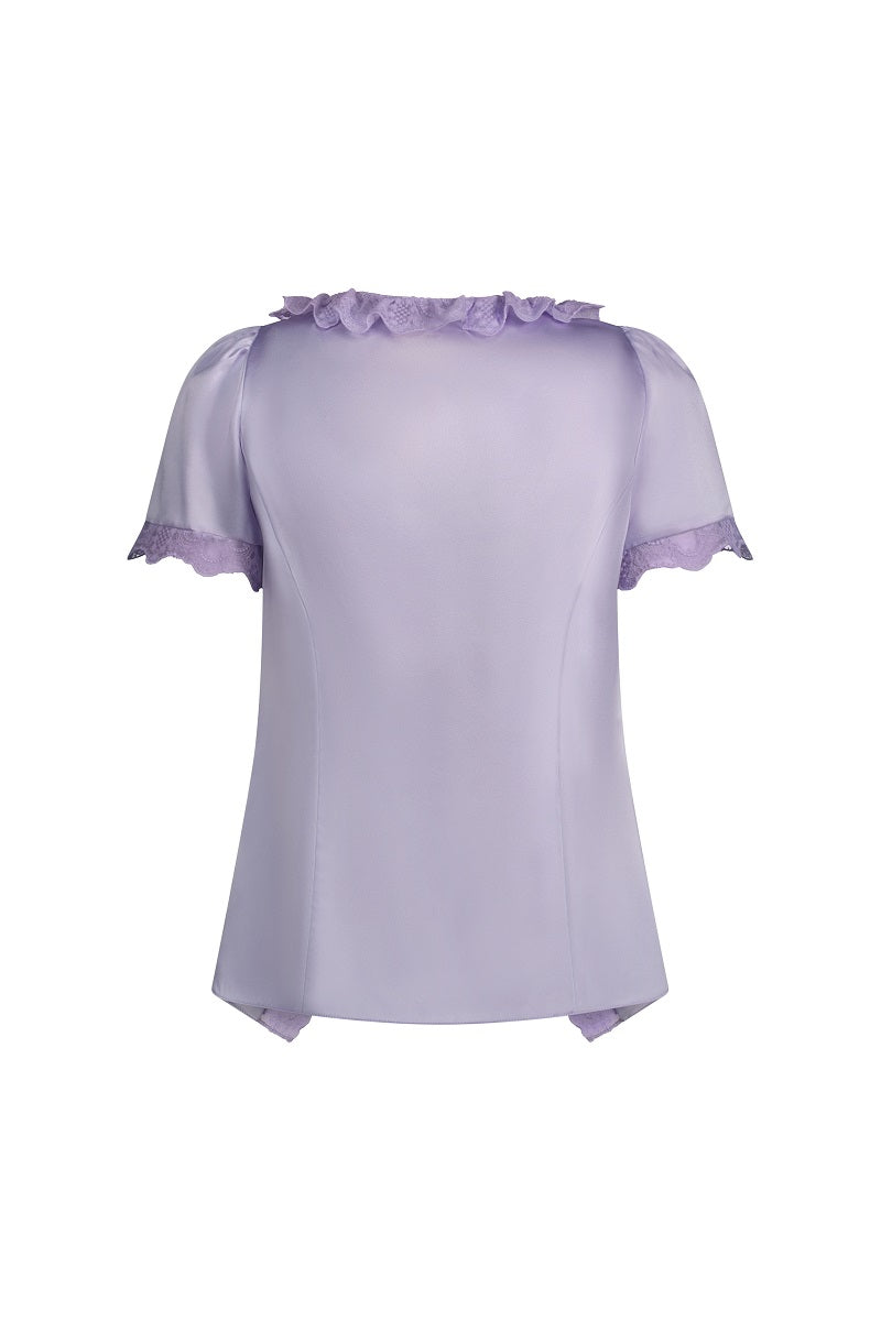 Scarlett Gasque Delilah Top featuring a stylish design, soft fabric, and feminine fit displayed on a hanger.