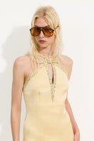 Urban Muse Delphine gown in butter yellow, elegant maxi dress with flowing fabric and stylish design.