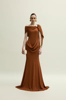 Jenny K Tran Devon gown in burnt orange, elegant evening dress with flowing fabric and stylish design.