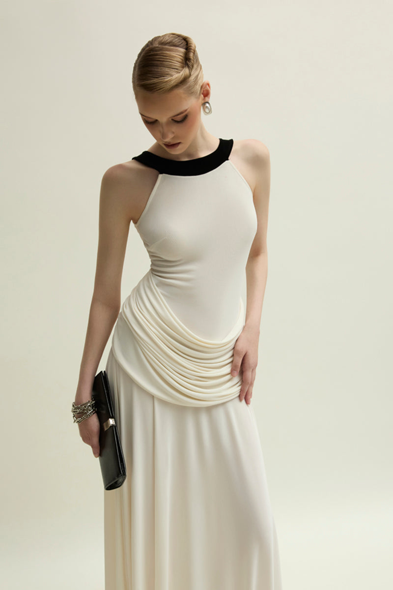 Elegant ivory Dorset gown by Jenny K Tran featuring delicate fabric details and a flowing silhouette.