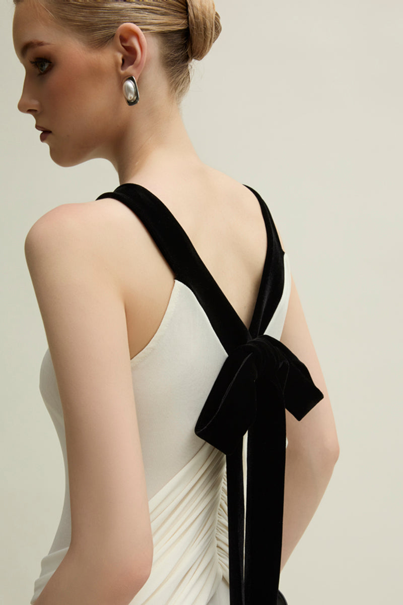 Jenny K Tran Dorset Ivory gown with elegant flowing fabric and intricate detailing, perfect for formal occasions.