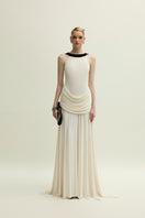 Elegant ivory Dorset gown by Jenny K Tran featuring flowing fabric and detailed design, perfect for formal occasions.