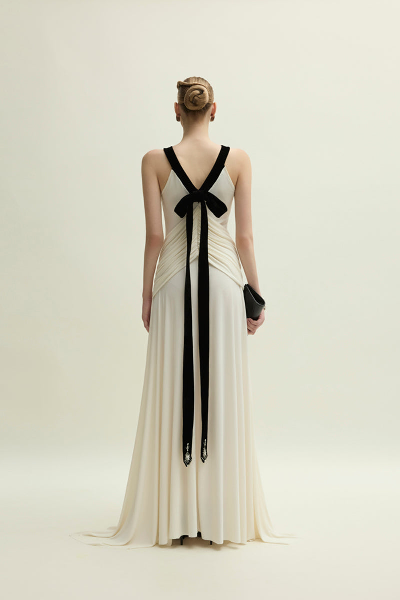 Ivory Dorset gown by Jenny K Tran featuring elegant fabric and a flattering silhouette, displayed on a dress form.