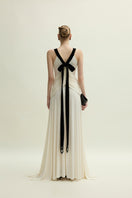 Ivory Dorset gown by Jenny K Tran featuring elegant fabric and a flattering silhouette, displayed on a dress form.