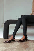 Pair of 10th Floor Downtown Heels in cocoa color, stylish high-heeled shoes with ankle straps and sleek design.