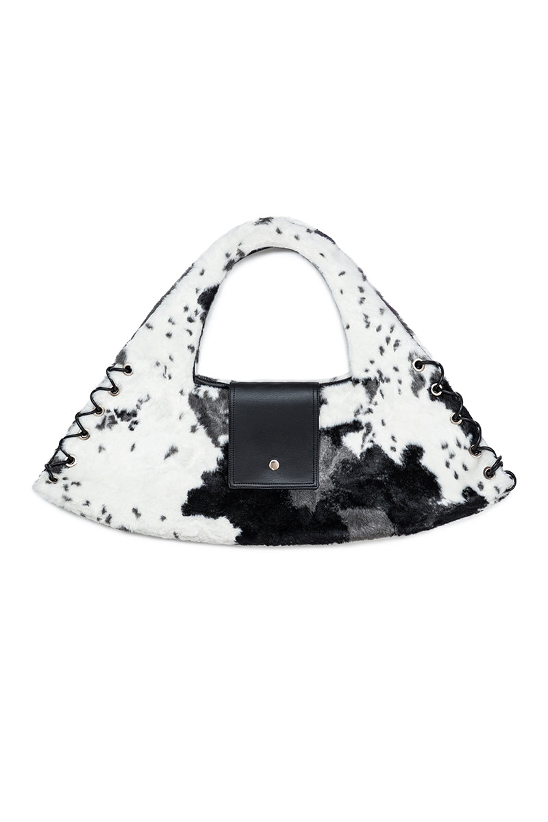 Sayya cow fur top handle bag with sturdy leather strap and sleek design, perfect for stylish everyday use.