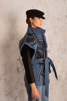 Nadya Shah Twist Denim Jacket with classic fit and button front, shown on a hanger against a neutral background.