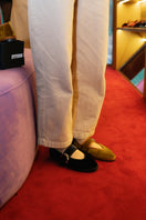 Flabelus Sophie black flats with black piping and buckle closure, stylish slip-on footwear for casual and dressy occasions.