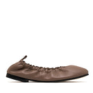 ALTA Connie Cocoa Flats showing beige slip-on flats with rounded toes and subtle stitching details.