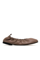 ALTA Connie Cocoa Flats showing beige slip-on flats with rounded toes and subtle stitching details.