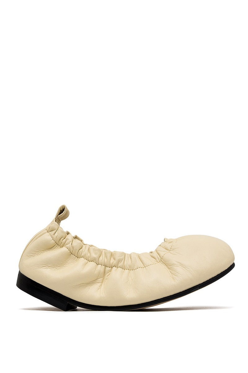 ALTA Connie Butter Flats, stylish women's flat shoes in butter-colored material, shown on a clean white background.