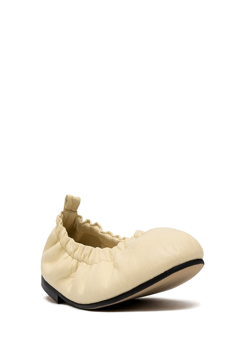 ALTA Connie Butter Flats, stylish beige flats with rounded toes, perfect for casual or office wear, shown on a model's feet.