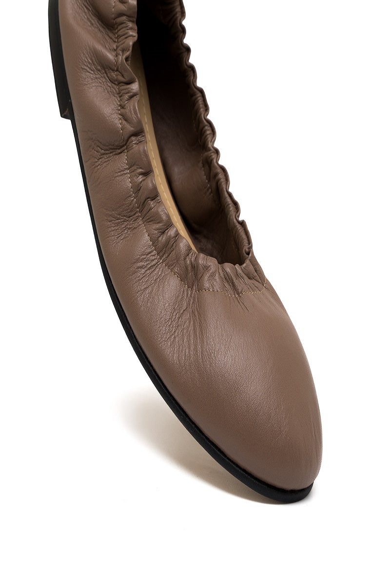 ALTA Connie Cocoa Flats showing beige slip-on flats with rounded toes and stitching detail on a plain background.