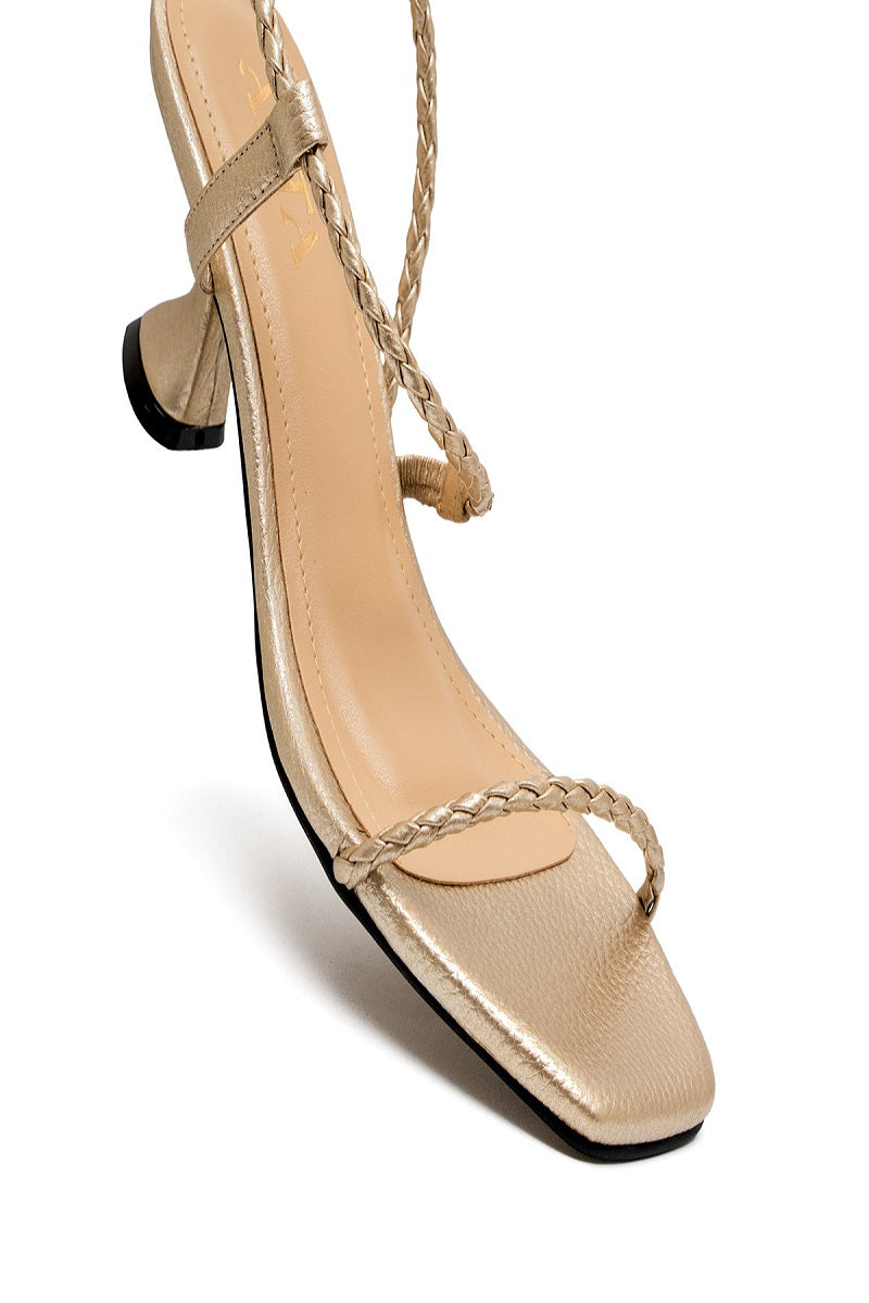 Alta Dora Gold Sandals with strappy design and flat sole, featuring metallic gold finish and comfortable footbed.