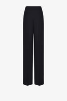 Black LEKIEU Kenya pants with a relaxed fit, shown hanging on a hanger against a plain background.