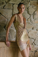 Maylé Vásquez ORO mini dress featuring stylish design, lightweight fabric, and a modern fit, shown on a model.