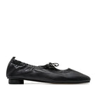 Black ALTA GEMMA flats with pointed toes and sleek design, shown on a white background.