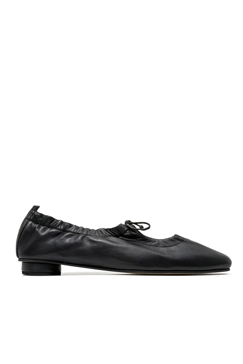 Black ALTA GEMMA flats with pointed toes and sleek design, shown on a white background.