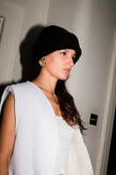 Verheyen Zina Biker shearling hat with black leather exterior and cozy shearling lining, stylish and warm for winter wear.