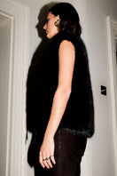 Black Verheyen Serena gilet jacket with a sleek, fitted design and zip closure, displayed on a plain background.