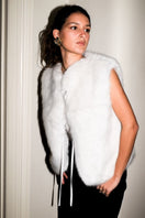 Verheyen Serena white gilet jacket displayed on a hanger, featuring a sleeveless design with a quilted pattern and front zipper closure.