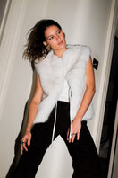 Verheyen Serena white gilet jacket displayed on a hanger with a clean background, showing its lightweight design and modern style.