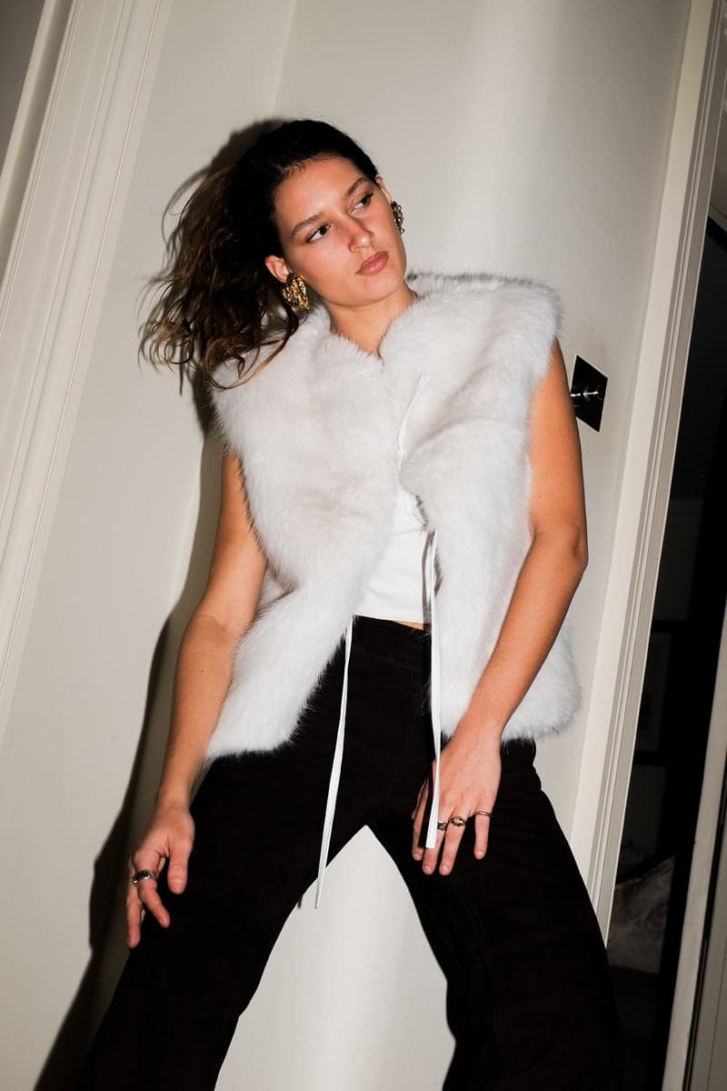 Verheyen Serena white gilet jacket displayed on a hanger with a clean background, showing its lightweight design and modern style.