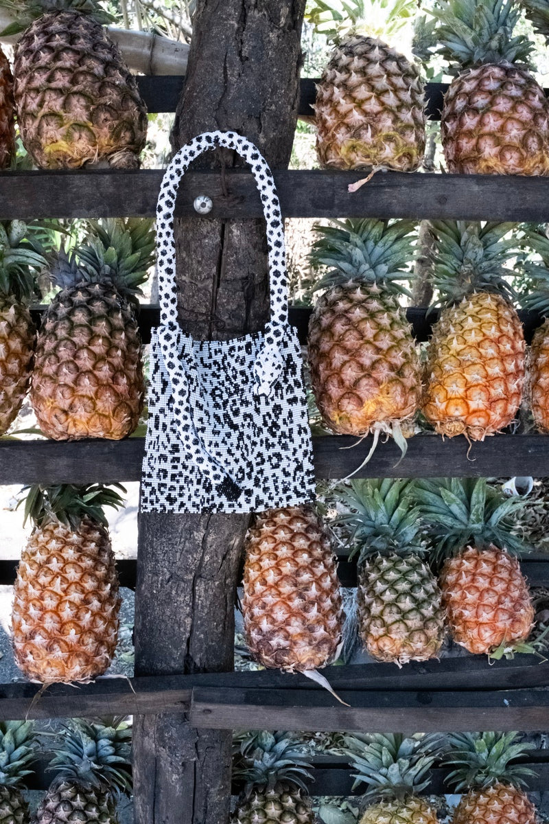 Snow leopard print Serpent shoulder bag by SAC DE SOUL, stylish handbag with chain strap and luxury design.