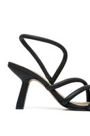 Black ALTA Ophelinna sandals featuring stylish open-toe heels with ankle straps and a sleek design.
