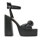 Black ALTA Emilia sandals with open toe design, ankle strap, and flat sole, perfect for casual summer wear.