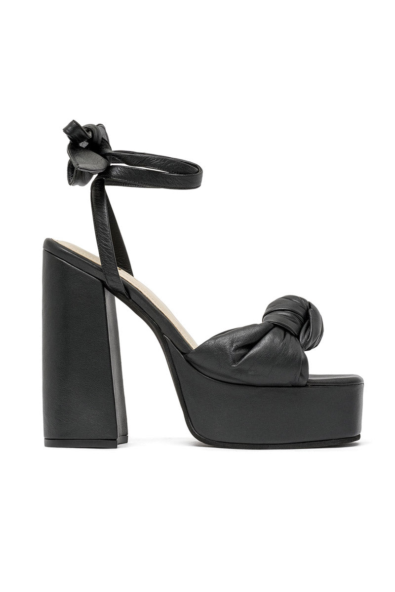 Black ALTA Emilia sandals with open toe design, ankle strap, and flat sole, perfect for casual summer wear.