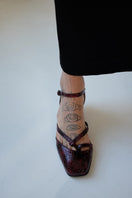 Gvasalia dark cherry embossed slingback heels with pointed toes and sleek design, stylish and elegant footwear.