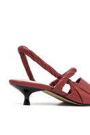 Alta Ginevra red high heels, stylish stiletto shoes with pointed toes, showcased on a neutral background.