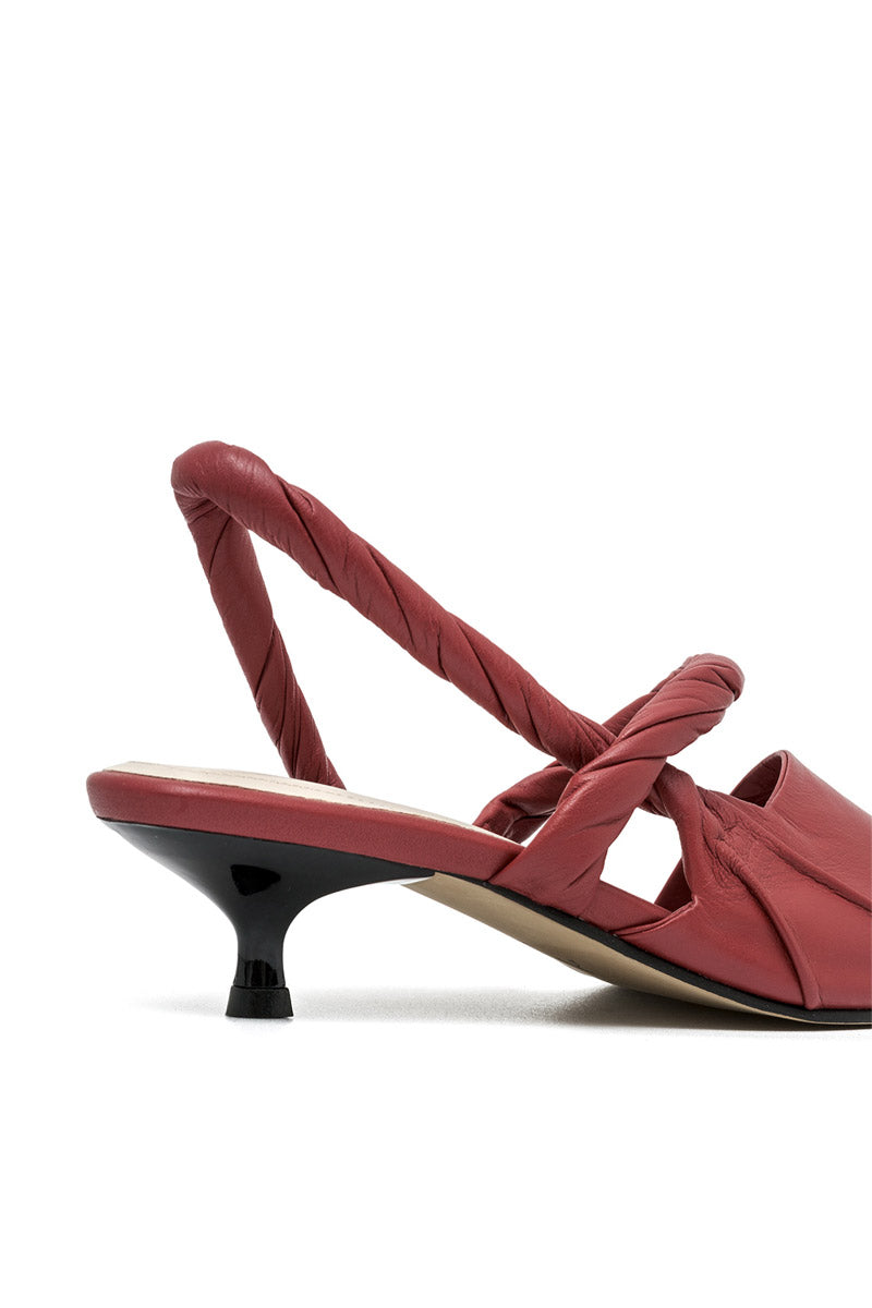 Alta Ginevra red high heels, stylish stiletto shoes with pointed toes, showcased on a neutral background.