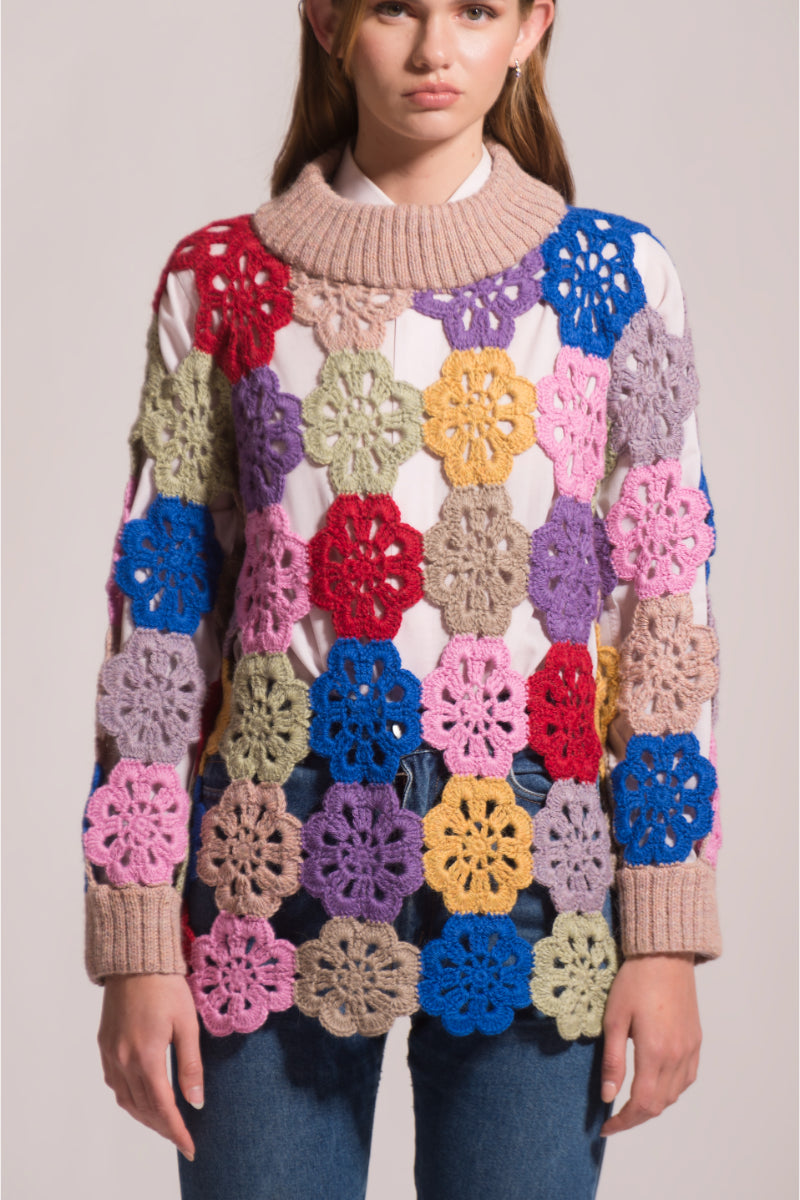 First Born Knits Edie crochet sweater featuring intricate knit patterns and a cozy fit, shown in a close-up view.
